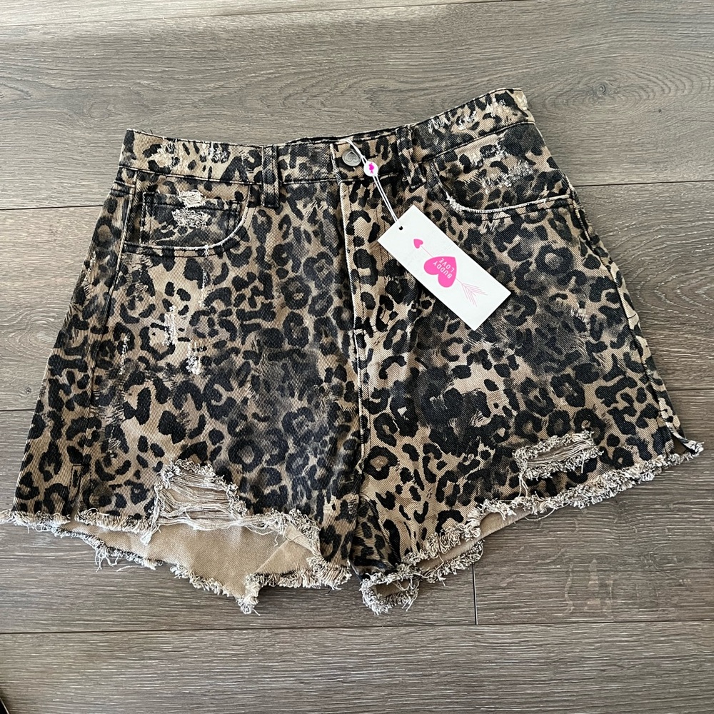 Leopard print distressed shorts